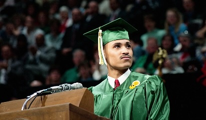 Bernard Owens delivering commencement address at MSU Breslin Center podium, 1993